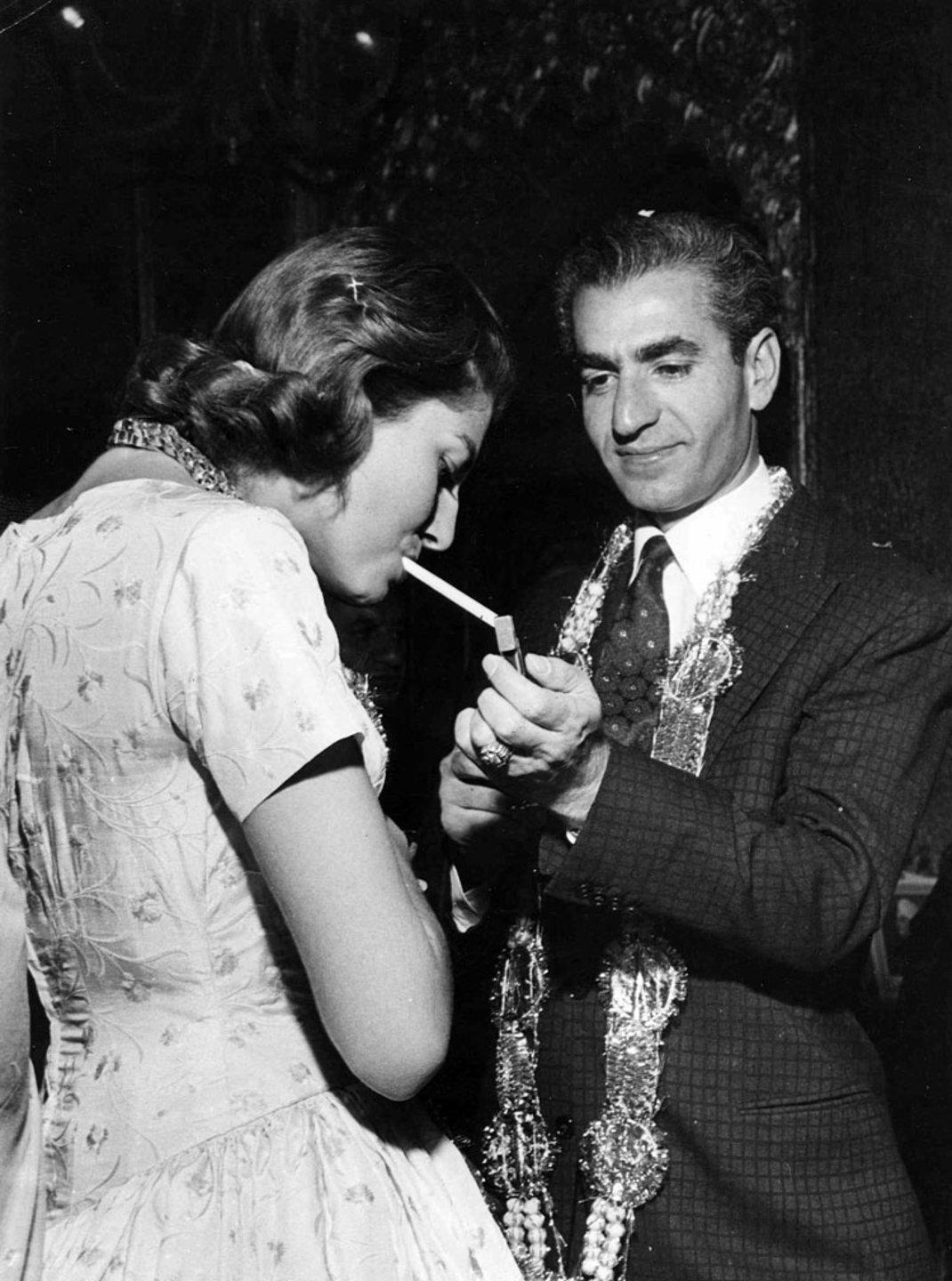 shah lighting cigarette for his wife sorraya bovary